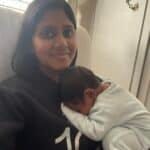 Vijithaa and newborn baby son snuggling