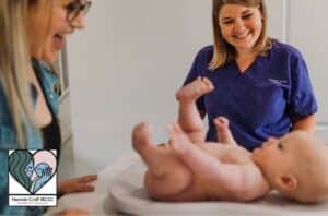 Hannah Croft IBCLC weighing baby
